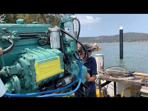 Craning the Detroit Diesel into the trawler