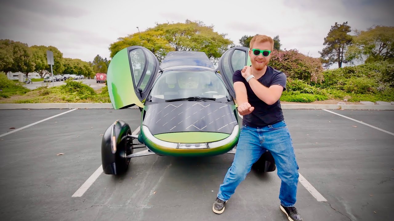 Aptera three-wheeled solar electric vehicle on a road