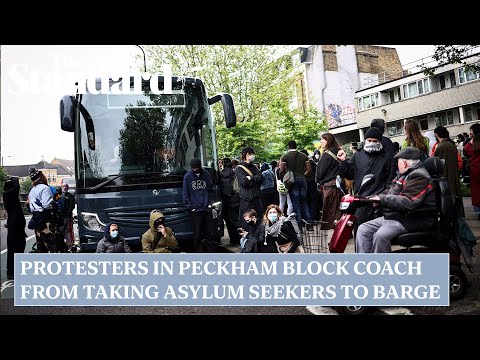 'Refugees are welcome here!': Protesters in Peckham block coach from taking asylum seekers to barge