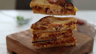 Hungarian style vegan grain salami in a grilled sandwich