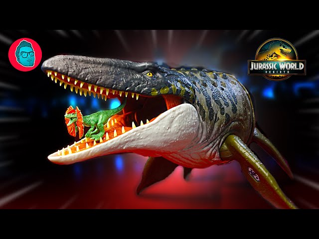 Vídeo relacionado con Mattel Jurassic World: El Renacer, Tiranotitán Grandes embestidas, Figura de dinosaurio de juguete, con 2 embestidas activadas con la cola, juego digital, JCL75