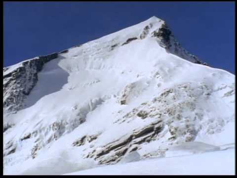 Bob Rankin and Eric Pehota ski down face of Mount Aspiring by Warren Miller
