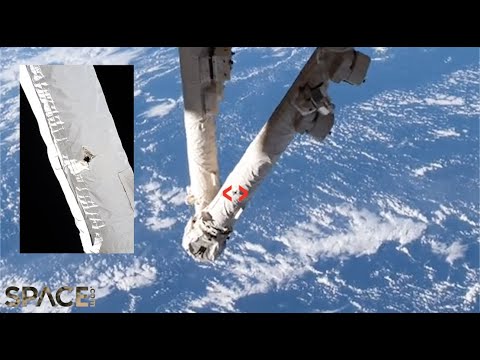 Space Station's robotic arm hit by orbital debris - See the hole!