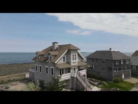 Rising up to reveal the ocean behind a house in Hull, MA
