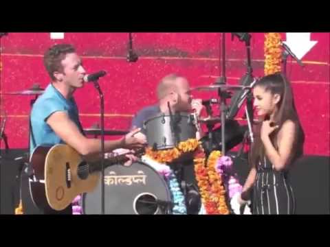 Chris Martin and Ariana singing "Just A Little Bit Of Your Heart" written by Harry on @GlblCtzn!