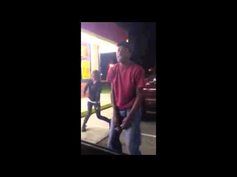 Drunk people dancing at gas station 