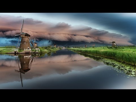 Epic Shelf Cloud Moves Over World Protected Windmills