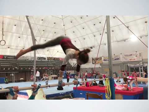 Developing movements on the girls Uneven Bars.