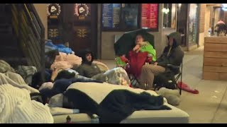 Michigan fans line up outside of popular bars hours before national championship game