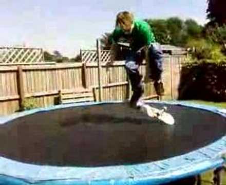 Alan on the trampoline with a skateboard