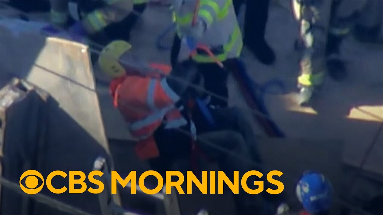 Video shows moment construction worker lifted to safety after trench collapse