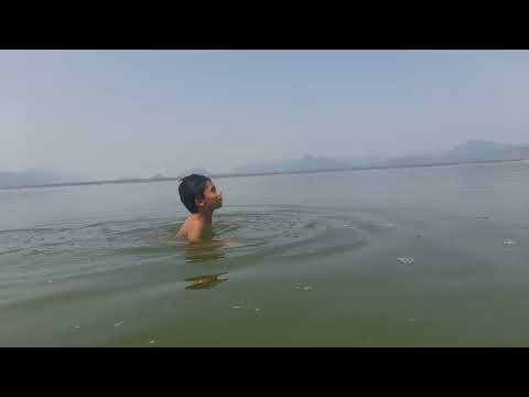Guhan swims in Mettur dam