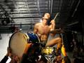 DMBQ Drummer hoisted up on drum set.