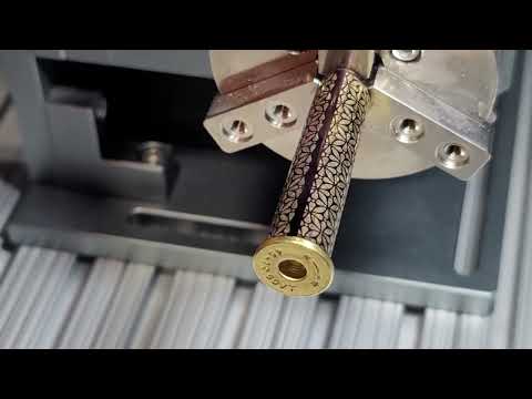 laser engraving on cylindrical objects, including rings and firearms barrels. www.vtronlasers.com