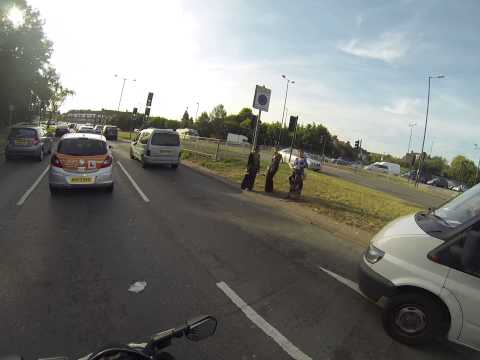North Circular A406 junction with A1, Roma people (not Romanians), washing windshields