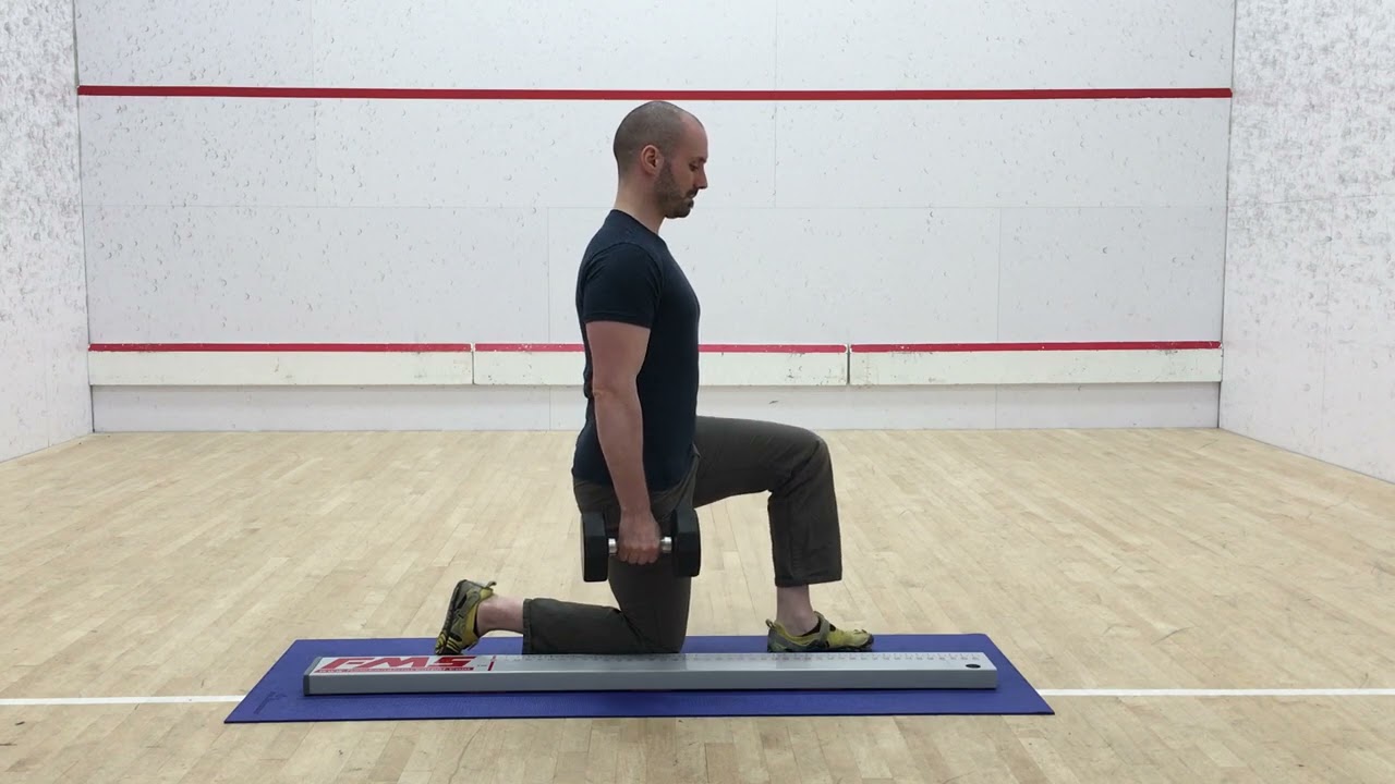 3. In Line Half Kneeling Suitcase Hold (Side View)