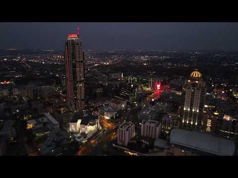 Night flight over Sandton City in 4K.
