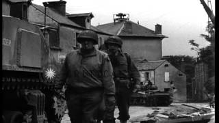 A military tank on a street in St Lo, France. HD Stock Footage