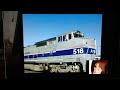 Peter Pan 1953 Mr Darling Chains Nana Outside Amtrak And BNSF Freight Train In Galesburg Illinois