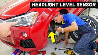 WHERE IS HEADLIGHT LEVEL SENSOR ON CAR WITH SELF LEVELING HEADLIGHTS