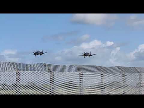 A pair of Beech T-6C Texan's T1 from RAF Valley land together at BAE Systems, Warton