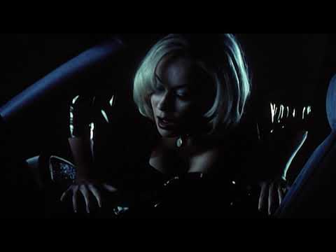 Bride of Chucky (1998) official trailer thumbnail with Chucky and Tiffany looming over a highway