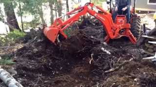 Successfully moving large Tree stump with Kubota tractorB2650 with 7'7" backhoe and la534 loader Successfully moving large Tree stump with Kubota tractorB2650 with 7'7" backhoe and la534 loader