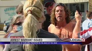 Warrant issued for suspect seen on video punching protester in Bethel