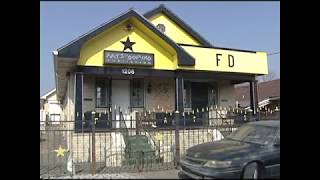 Fats Domino gives Eric Paulsen a look at his home post-Katrina