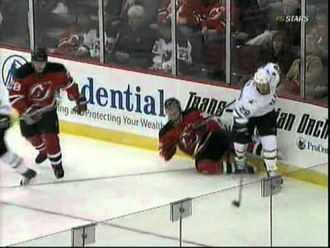 Jamie Benn hits Anton Volchenkov into the bench