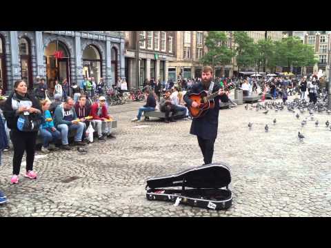 Street musician Singing Bob Marley no woman no cry in Amsterdam
