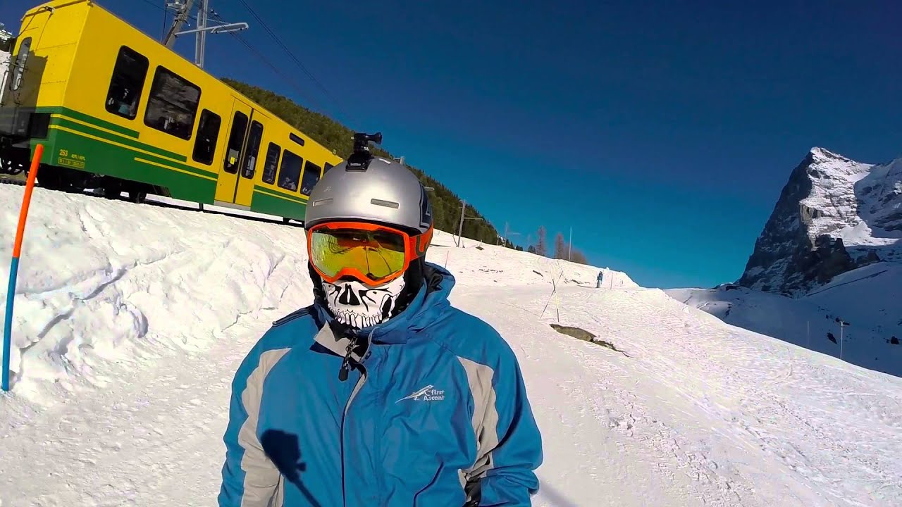 Experience the thrill of snowboarding in the breathtaking landscape of Wengen.