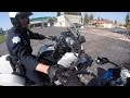 Watch 'Coolest Cop' Give Biker Fist Bump, Laugh and Warning To His Surprise