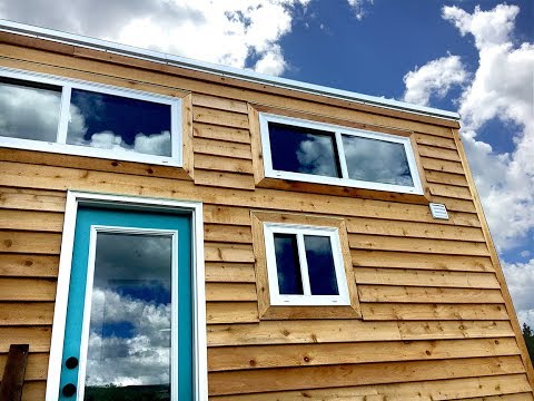 Main level bedroom in tiny home