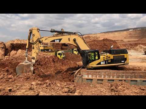 Two Caterpillar 365C Excavators Loading Trucks