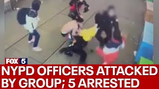 NYPD officers attacked by group  5 arrested
