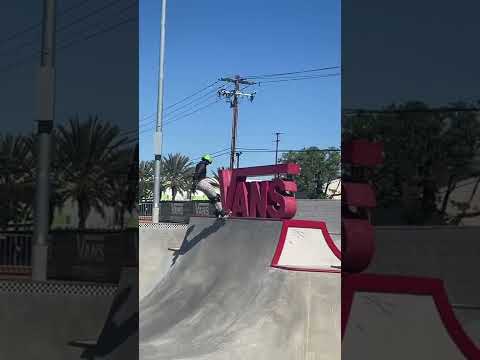 Stall the coping of the Vans skatepark sign
