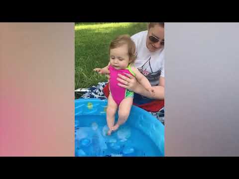 Cute baby is afraid of water