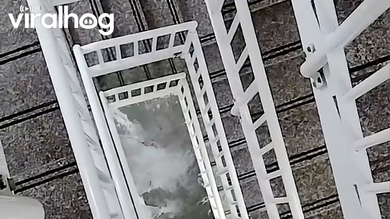 Heavy Rain Turns Apartment Stairway Into Waterfall || ViralHog