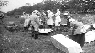 Dead bodies of soldiers killed by Nazis are exhumed from a mass grave and placed ...HD Stock Footage