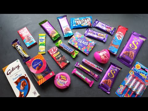 100 candies opening, surprise toys, chocolate a video, lots of chocolates, Cadbury celebration