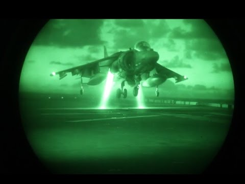 AV-8B Harriers practice landing at night on USS Bonhomme Richard