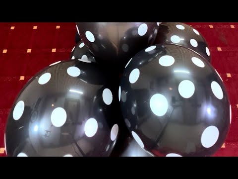 Six black white dots balloons .