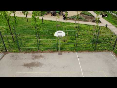 Taking off from a basketball court (Budapest, Hungary) - 90 degree Tilting Ascension shot