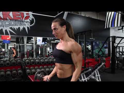 Muscular Woman Training Biceps