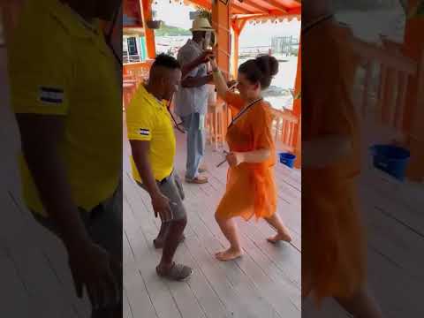 Cute couple dancing on West Bay Beach Roatan Caribbean island Babalu’s Bar and Grill