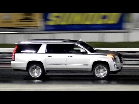 2015 Escalade vs 2015 Mustang GT - 1/4 Mile Drag Race - Road Test TV ®