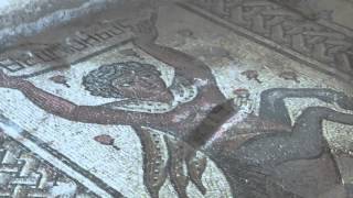 preview picture of video 'Sepphoris, Zippori, Israel - The Nile house. - Mosaic of a satyr holding a sign saying God willing'