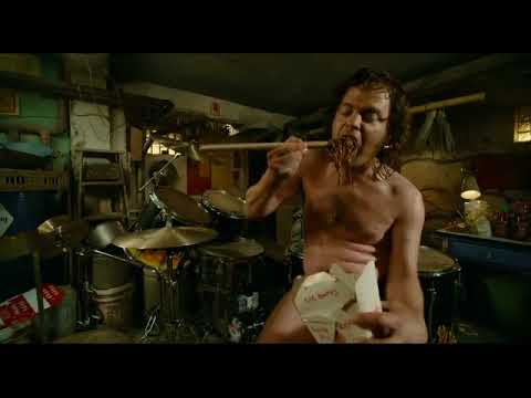 The Rocker (2008) trailer still: Rainn Wilson as 'Fish' behind a drum kit under arena lights
