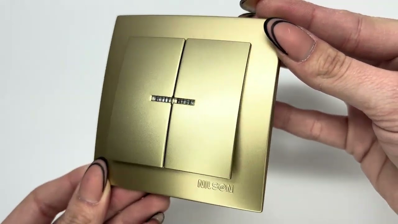 Вимикач двоклавішний з підсвіткою NILSON Touran Золото 24151004